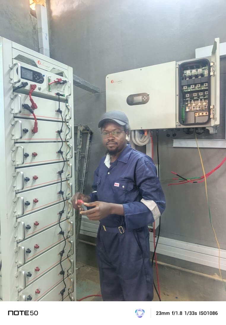 Optive Forte technician working on a battery and inverter installation